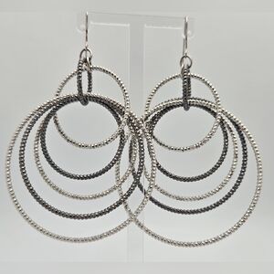 GUESS Silvertone Textured Orbital Wire Linear Drop Hoop Earrings  Statement
